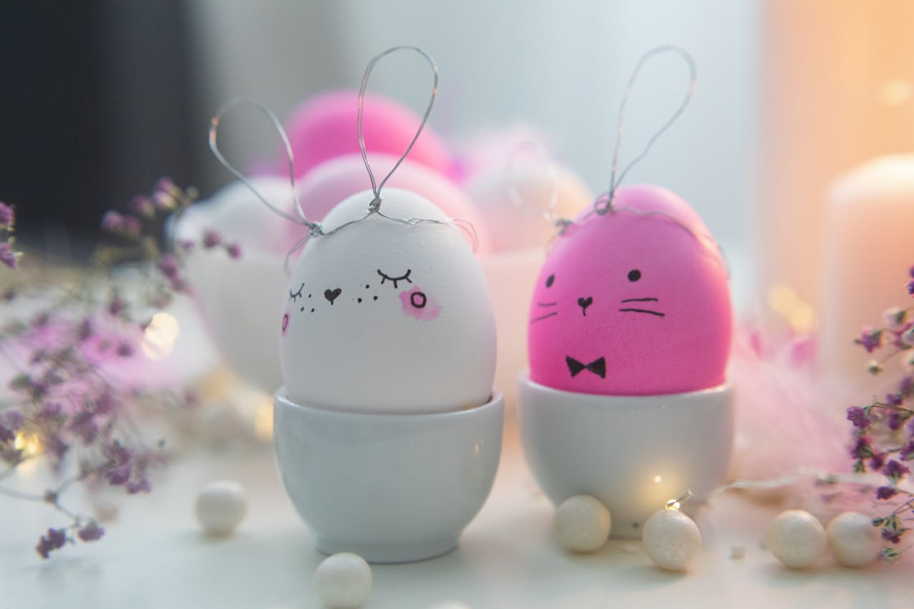 Charming Easter eggs with bunny faces in soft pastel colors for seasonal decoration.